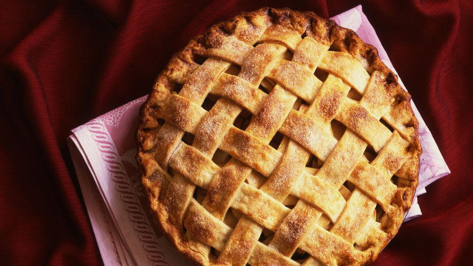 Lattice-top apple pie on a red cloth